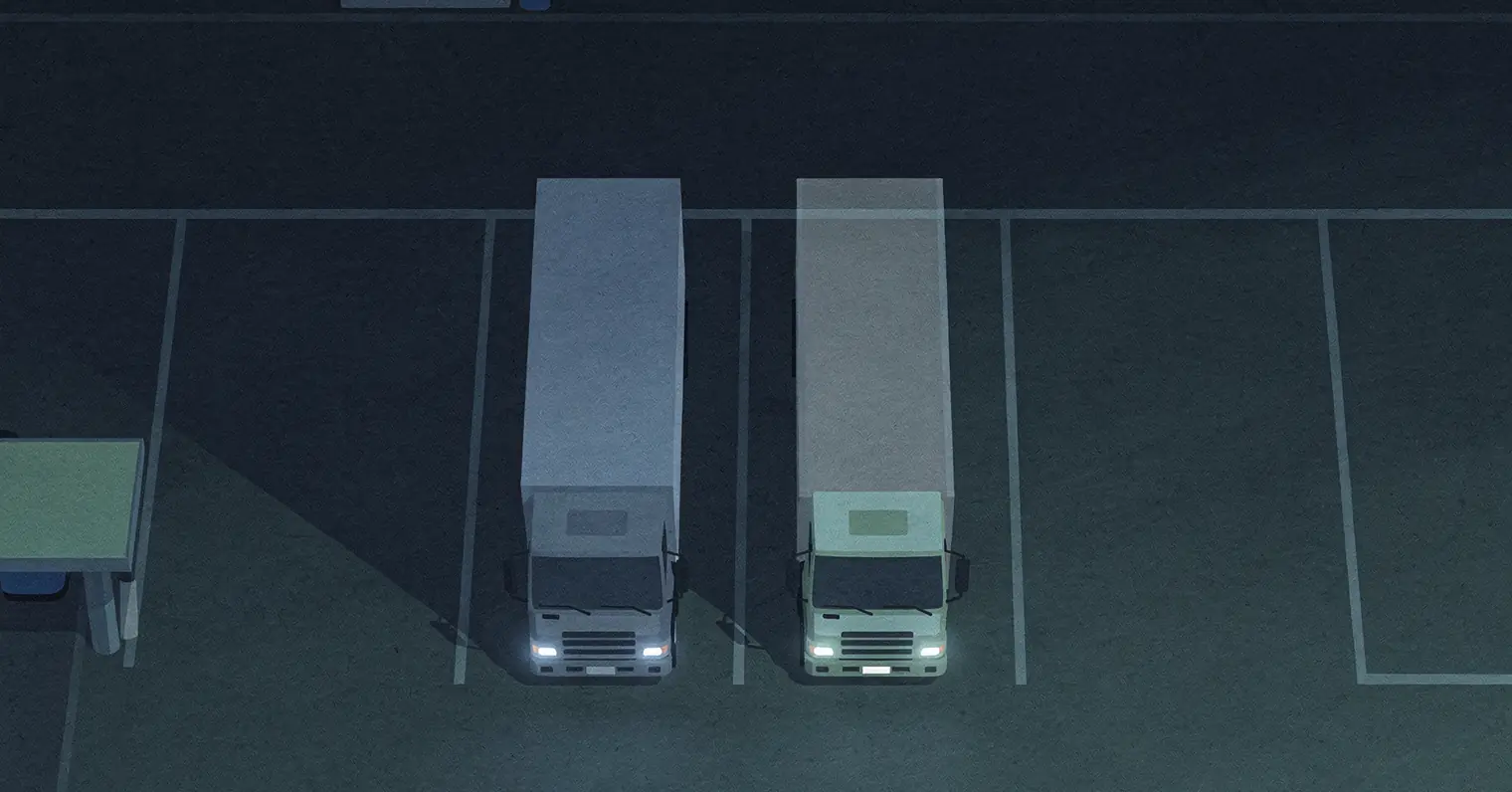 Illustration: two identical trucks parked side by side at night, the second a faint ghost of the first